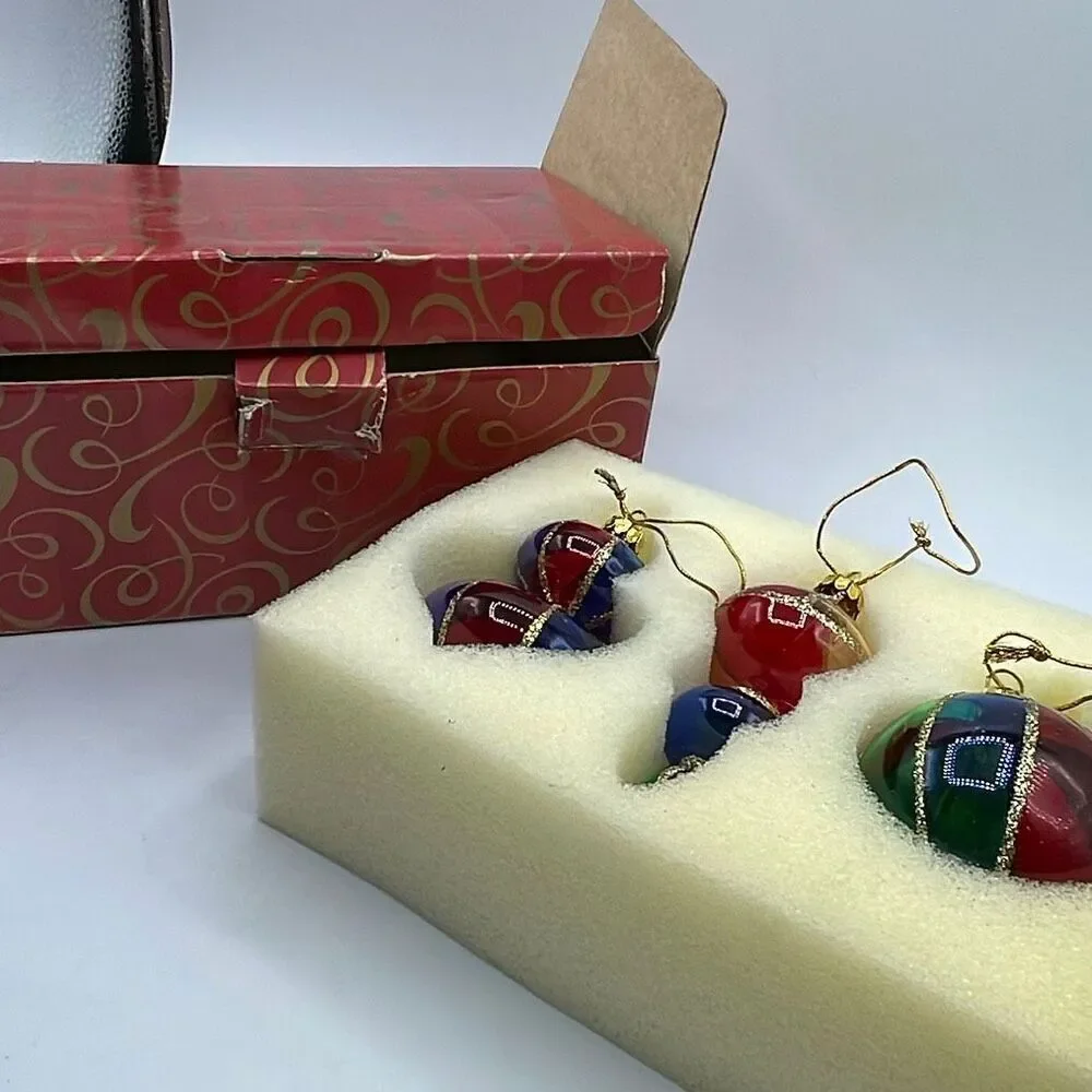 Vintage Avon 2001 Holiday Treasures blown glass ornaments.